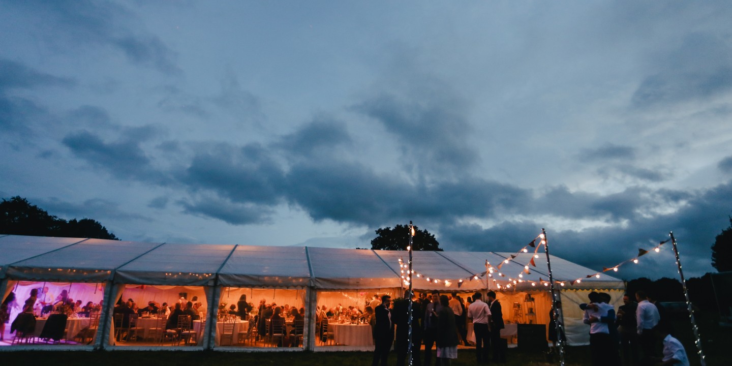 a wedding reception in a tent